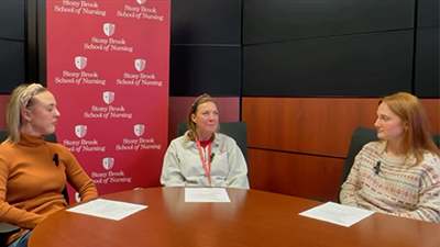 SBSNA PRN podcast hosts sitting at a table.